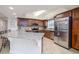 Gourmet kitchen with granite countertops, stainless steel appliances and custom cabinetry at 5300 S Atlantic Ave # 17-207, New Smyrna Beach, FL 32169