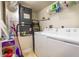 Bright laundry room with a washer and dryer, built in shelving, and a furnace at 5300 S Atlantic Ave # 17-207, New Smyrna Beach, FL 32169