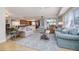 The spacious living room is illuminated by natural light and seamlessly connects to the gourmet kitchen at 5300 S Atlantic Ave # 17-207, New Smyrna Beach, FL 32169