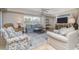 Relax in this open living area with modern decor and plenty of natural light at 5300 S Atlantic Ave # 17-207, New Smyrna Beach, FL 32169