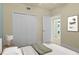 Practical bedroom with a closet, featuring a bed, bedside tables, and minimalistic decor at 5300 S Atlantic Ave # 19-403, New Smyrna Beach, FL 32169