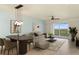 Comfortable living room featuring stylish furniture, decor, and an inviting atmosphere with a view to the outdoor at 5300 S Atlantic Ave # 19-403, New Smyrna Beach, FL 32169