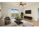 Relaxing living room with a balcony view, complemented by tasteful decor and comfortable seating at 5300 S Atlantic Ave # 19-403, New Smyrna Beach, FL 32169