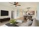 Spacious living room with sleek furniture, modern decor, and an open layout to the kitchen at 5300 S Atlantic Ave # 19-403, New Smyrna Beach, FL 32169