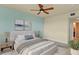 Cozy main bedroom with a serene ambiance, adorned with calming artwork and soft, neutral tones at 5300 S Atlantic Ave # 19-403, New Smyrna Beach, FL 32169