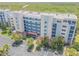 Aerial view of a condo building with beautiful marsh views from the rooftop at 5300 S Atlantic Ave # 9-206, New Smyrna Beach, FL 32169