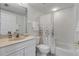 Clean bathroom with a shower-tub combo, vanity, and ample lighting at 5300 S Atlantic Ave # 9-206, New Smyrna Beach, FL 32169