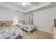 Well lit bedroom with two beds and a ceiling fan at 5300 S Atlantic Ave # 9-206, New Smyrna Beach, FL 32169