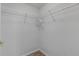 Empty walk-in closet with built-in shelving and a hanging rod for optimal organization at 5300 S Atlantic Ave # 9-206, New Smyrna Beach, FL 32169