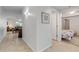 Inviting hallway featuring tile flooring, access to rooms and decorative wall art at 5300 S Atlantic Ave # 9-206, New Smyrna Beach, FL 32169