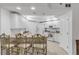 Bright kitchen features white cabinetry, breakfast bar, and modern appliances at 5300 S Atlantic Ave # 9-206, New Smyrna Beach, FL 32169