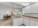 Cozy kitchen with tile backsplash and stainless steel double sink at 5300 S Atlantic Ave # 9-206, New Smyrna Beach, FL 32169