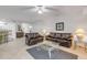 Spacious living room featuring comfortable seating, natural light, and an open floor plan at 5300 S Atlantic Ave # 9-206, New Smyrna Beach, FL 32169