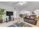 Open living room with comfortable seating and access to the kitchen at 5300 S Atlantic Ave # 9-206, New Smyrna Beach, FL 32169