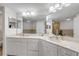 Bathroom with double sinks and large mirror at 5300 S Atlantic Ave # 9-206, New Smyrna Beach, FL 32169