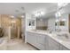 Bathroom with double sinks, walk in shower and a bathtub at 5300 S Atlantic Ave # 9-206, New Smyrna Beach, FL 32169
