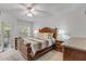 Beautiful main bedroom suite with a large bed and a view to the balcony and the yard at 5300 S Atlantic Ave # 9-206, New Smyrna Beach, FL 32169