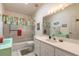 Well-lit bathroom featuring a combination shower and tub, framed mirror, and coordinated decor at 5430 Dubois Ave, Port Orange, FL 32127
