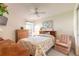 Cozy bedroom with a ceiling fan, complemented by soothing decor and natural light at 5430 Dubois Ave, Port Orange, FL 32127