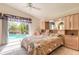 Comfortable bedroom with a pool view through the sliding glass doors to the outside at 5430 Dubois Ave, Port Orange, FL 32127