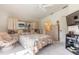 Cozy bedroom with plenty of storage, TV, and a view into the bathroom at 5430 Dubois Ave, Port Orange, FL 32127