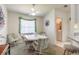 Cozy dining area with ceiling fan, laundry area, and comfortable seating at 5430 Dubois Ave, Port Orange, FL 32127