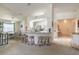 Dining area with table, chairs and window, next to an open breakfast bar and kitchen at 5430 Dubois Ave, Port Orange, FL 32127