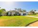 Charming home featuring a well-maintained lawn and a two-car garage with a spacious driveway at 5430 Dubois Ave, Port Orange, FL 32127
