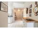 Bright hallway featuring white walls, neutral tile, and modern accents at 5430 Dubois Ave, Port Orange, FL 32127