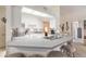 Well-lit kitchen featuring white cabinetry, stainless steel appliances, and breakfast bar at 5430 Dubois Ave, Port Orange, FL 32127