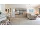 Spacious living room featuring built in shelving, clocks, and comfortable sectional seating at 5430 Dubois Ave, Port Orange, FL 32127