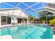 Inviting screened pool and spa with a covered lanai for outdoor dining and relaxation at 5430 Dubois Ave, Port Orange, FL 32127