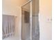 Modern glass shower with grab bar and built-in seat at 5430 Dubois Ave, Port Orange, FL 32127