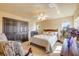 Bright bedroom featuring a large bed, closet, sitting area, and natural light at 610 Mura Ct, New Smyrna Beach, FL 32168