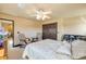 Comfortable bedroom featuring a spacious bed, closet, sitting area, and bright windows at 610 Mura Ct, New Smyrna Beach, FL 32168