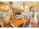 Dining room with a view of the living room, hardwood floors and an elegant dining set at 610 Mura Ct, New Smyrna Beach, FL 32168