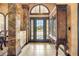 Welcoming foyer with tile flooring, decorative pillars, and an elegant display cabinet at 610 Mura Ct, New Smyrna Beach, FL 32168