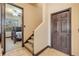 Inviting hallway featuring carpeted stairs, a bedroom entrance, and a closet at 610 Mura Ct, New Smyrna Beach, FL 32168
