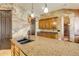 The kitchen includes a large island and granite countertops at 610 Mura Ct, New Smyrna Beach, FL 32168