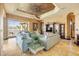Cozy living room with large windows, neutral colors and view of pool and canal at 610 Mura Ct, New Smyrna Beach, FL 32168