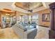 Bright living room with tile floors, a ceiling fan, comfortable seating, and water views at 610 Mura Ct, New Smyrna Beach, FL 32168