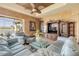 Comfortable living room with elegant furniture, glass table, and entertainment center at 610 Mura Ct, New Smyrna Beach, FL 32168