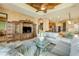 The living room features tile floors, large windows and a ceiling fan at 610 Mura Ct, New Smyrna Beach, FL 32168