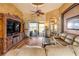 Open living room with hardwood flooring and sliding glass doors opening to the outdoor space at 610 Mura Ct, New Smyrna Beach, FL 32168