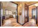 Primary bedroom suite with sitting area, view of Primary bathroom and hallway at 610 Mura Ct, New Smyrna Beach, FL 32168