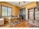 Office space with hardwood flooring and an ornate desk and bookcase at 610 Mura Ct, New Smyrna Beach, FL 32168