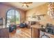 Beautiful office with a large window, hardwood floors, and stylish decor and furniture at 610 Mura Ct, New Smyrna Beach, FL 32168