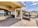 Large screened patio with seating area, dining set, and a built-in pool, perfect for lakeside entertaining at 610 Mura Ct, New Smyrna Beach, FL 32168