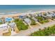 Aerial view of coastal homes near the beach and ocean at 6361 Turtlemound Rd, New Smyrna Beach, FL 32169