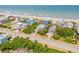An aerial view of homes near the tranquil beach and ocean at 6361 Turtlemound Rd, New Smyrna Beach, FL 32169